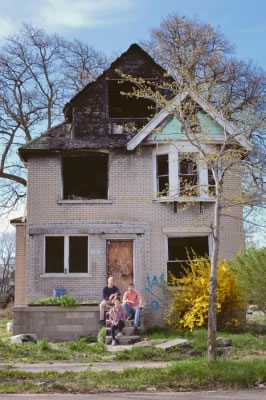 Tyson Gersh (left), Darin McLeskey, and Shelby Wilson are the brains and calloused hands behind the Michigan Urban Farming Initiative. McLeskey is hoping to buy this home from its owner, who lives in California.