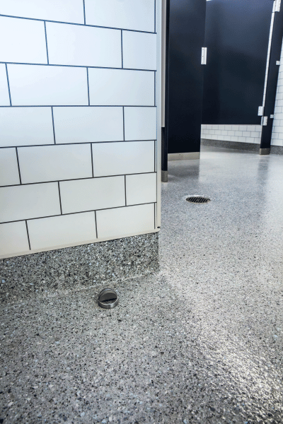 Fast-Curing-Resinous-Flooring--Fig3_KeystoneCollaborative_BathroomFloorDrainDoorStop